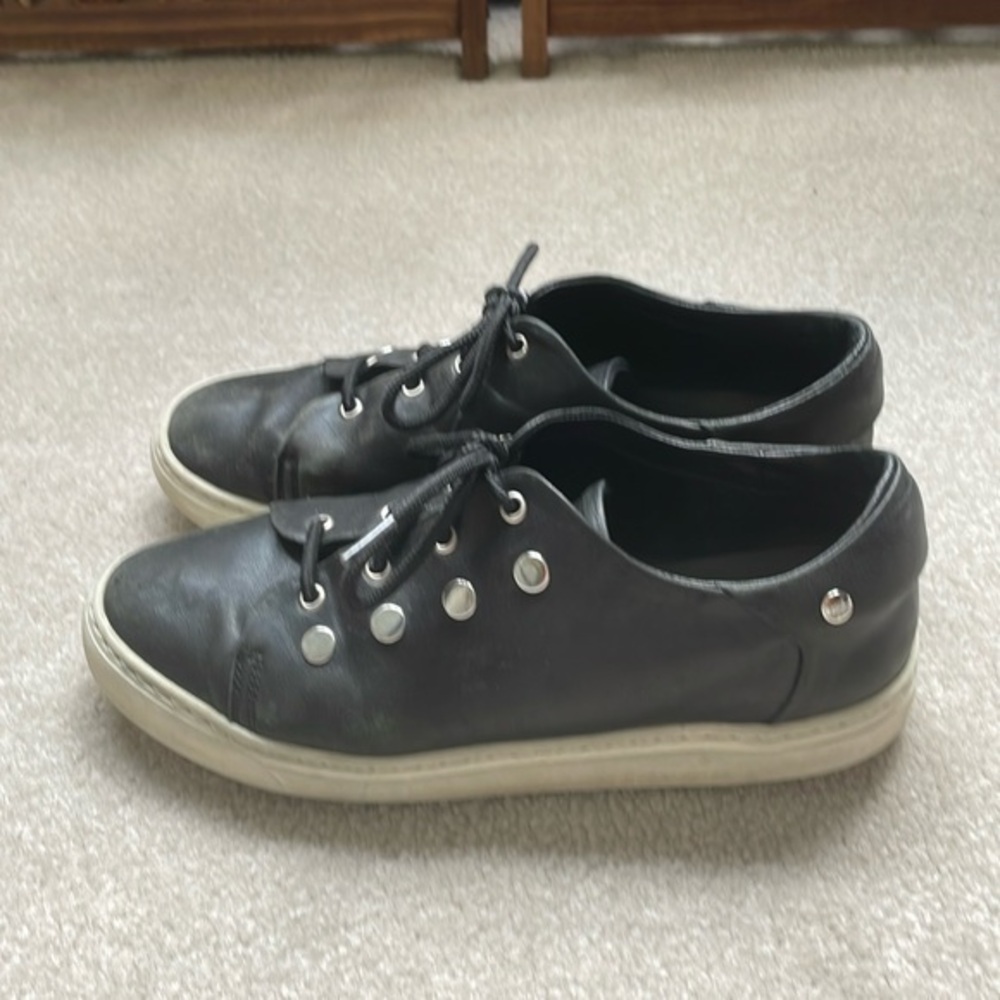 AGL black leather sneakers with silver disc detail